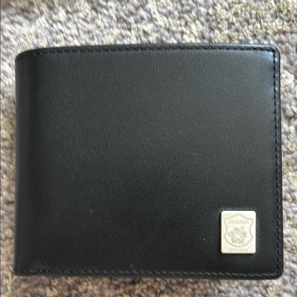 Minimalist Black Leather Wallet with Chrome Emblem